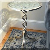 F07. Glass and metal side tables. 